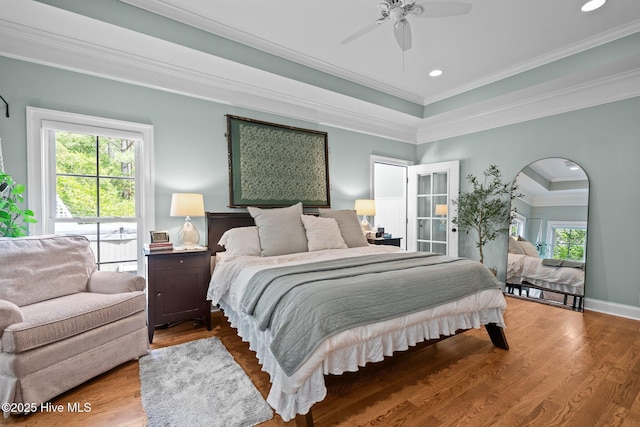 3681 Fairfield Way, Southport, NC 28461 - bedroom featuring crown molding, wood finished floors, ceiling fan, recessed lighting, and arched walkways