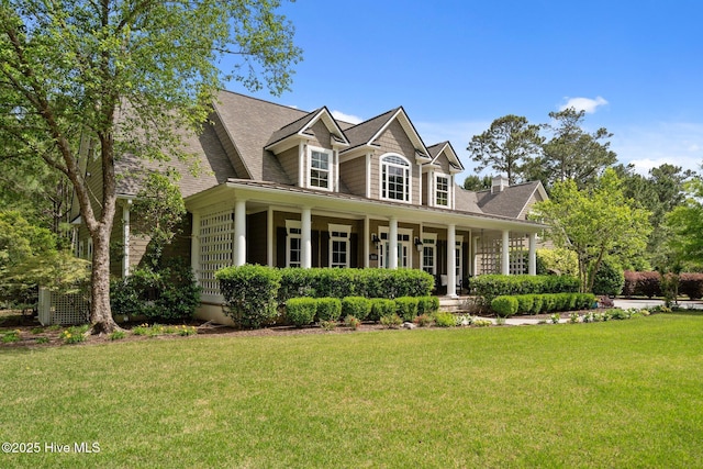 3681 Fairfield Way, Southport, NC 28461 - cape cod-style house with a front lawn and a porch