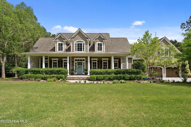 3681 Fairfield Way, Southport, NC 28461 - cape cod-style house with a standing seam roof, a porch, a front lawn, and a metal roof