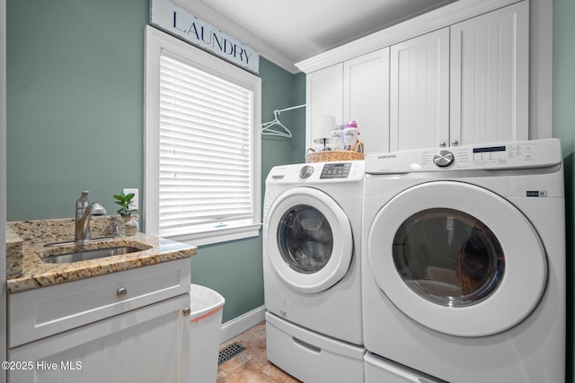 3681 Fairfield Way, Southport, NC 28461 - laundry room with washing machine and clothes dryer and cabinet space