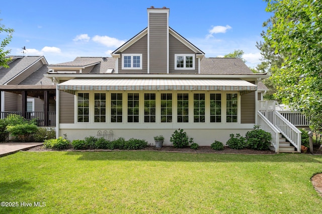 3681 Fairfield Way, Southport, NC 28461 - back of property with a lawn, a chimney, and stucco siding