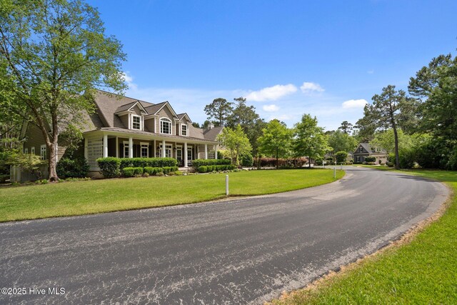 3681 Fairfield Way, Southport, NC 28461 - cape cod-style house featuring a front lawn
