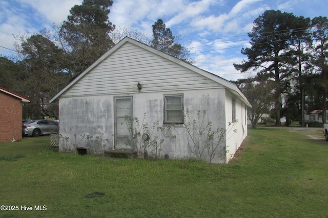 view of home's exterior with a yard