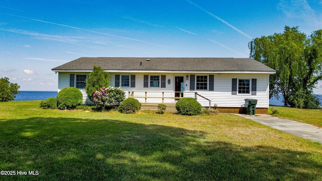 single story home featuring a water view and a front yard