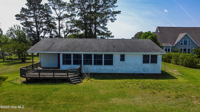 back of property featuring a wooden deck, a yard, and crawl space