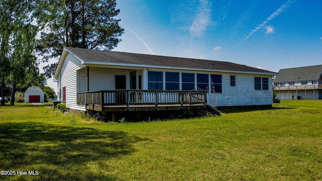 back of house with a lawn, covered porch, and a garage