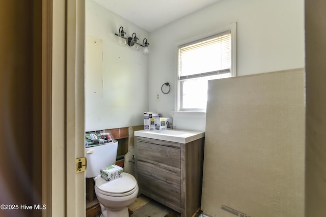 half bath with vanity and toilet
