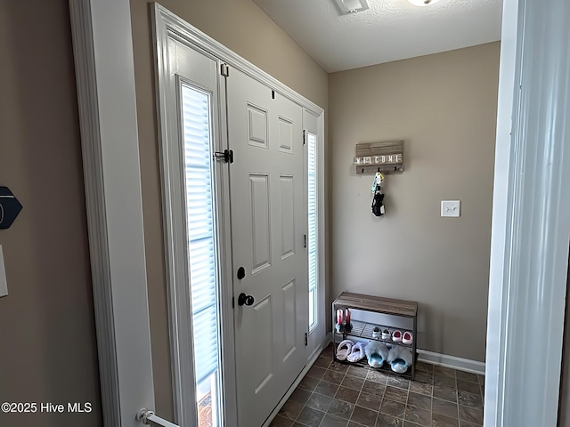 entrance foyer featuring baseboards