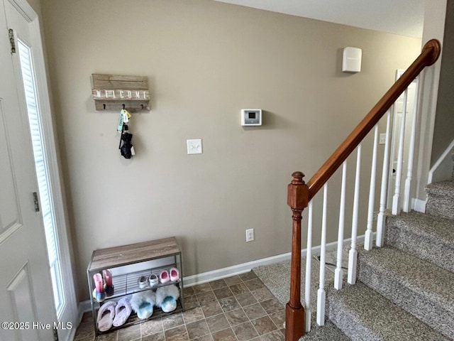 stairway featuring baseboards