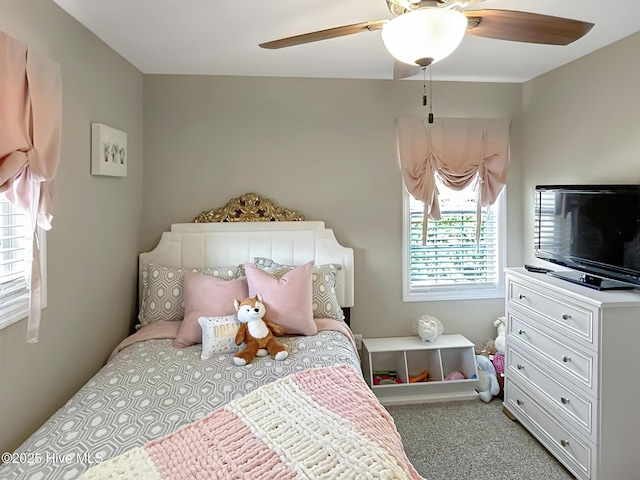 carpeted bedroom with a ceiling fan