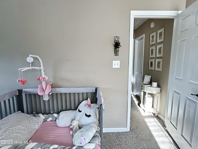 carpeted bedroom featuring baseboards
