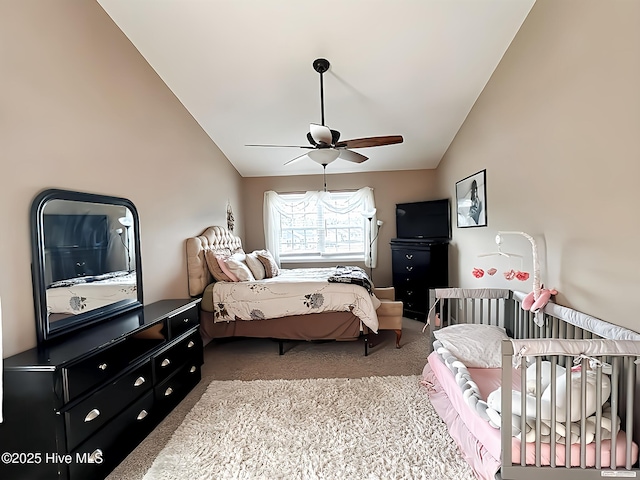 bedroom featuring carpet floors, ceiling fan, and vaulted ceiling