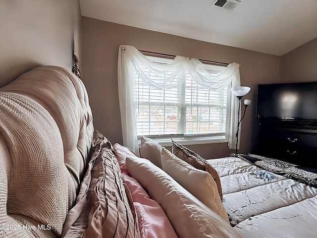 bedroom featuring visible vents