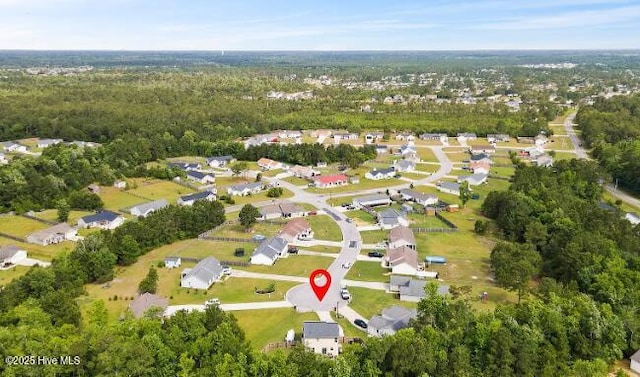 aerial view with a forest view and a residential view