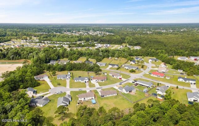 birds eye view of property with a residential view
