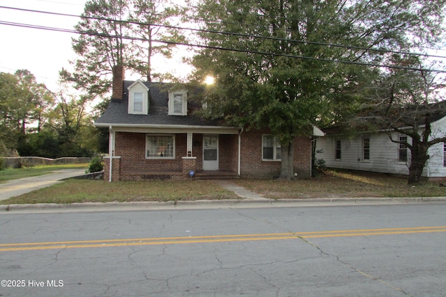 803 Mccoy St, Clinton, NC 28328 - view of front of property with brick siding and a chimney