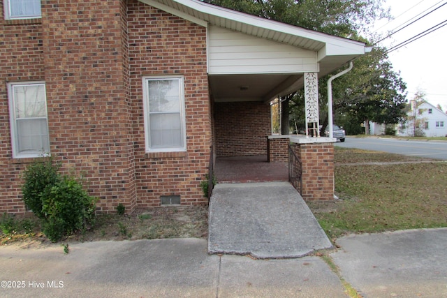 803 Mccoy St, Clinton, NC 28328 - exterior space with brick siding and covered porch