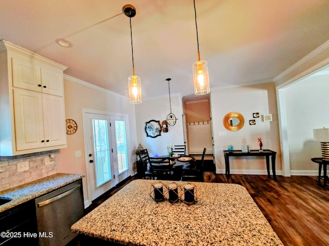 kitchen with stainless steel dishwasher, light stone counters, ornamental molding, and dark wood-style floors