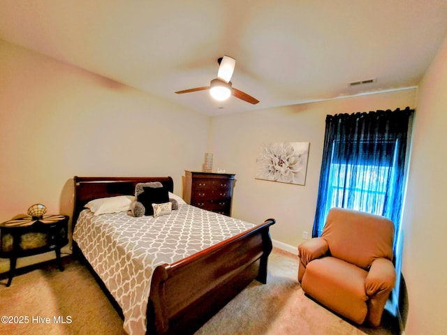 bedroom with carpet, visible vents, baseboards, and a ceiling fan