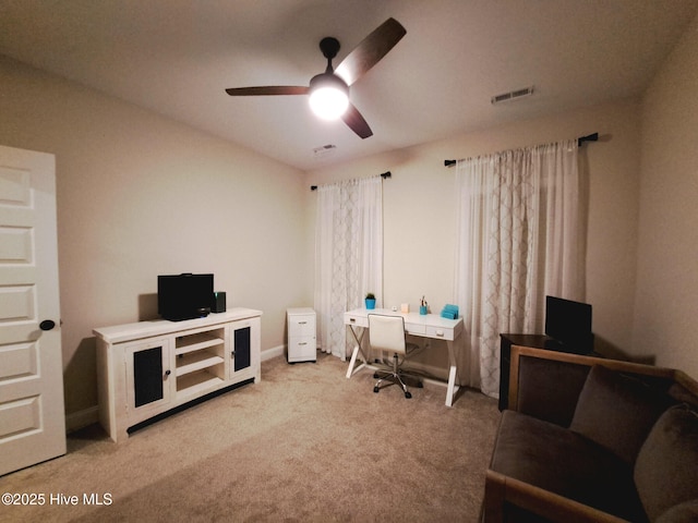 office area featuring carpet flooring, a ceiling fan, and visible vents