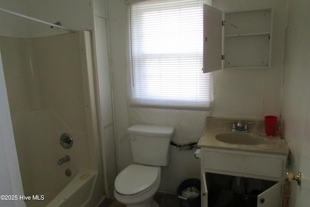 bathroom featuring toilet, washtub / shower combination, and vanity
