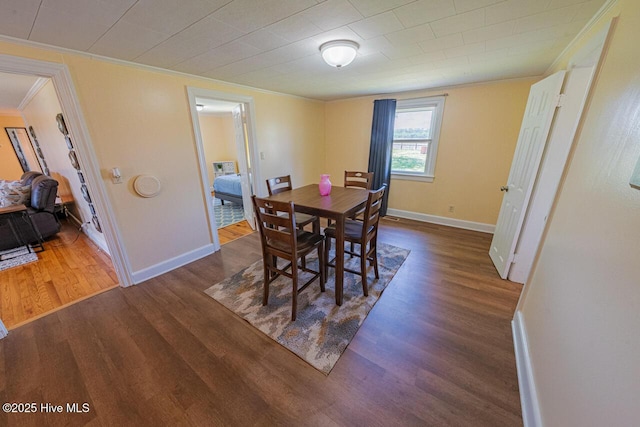 465 Meadstown Rd, Elizabeth City, NC 27909 - dining area featuring crown molding, baseboards, and wood finished floors