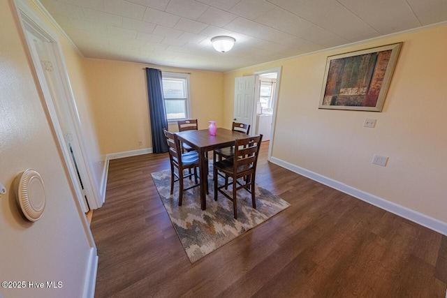 465 Meadstown Rd, Elizabeth City, NC 27909 - dining room featuring dark wood-type flooring, ornamental molding, and baseboards