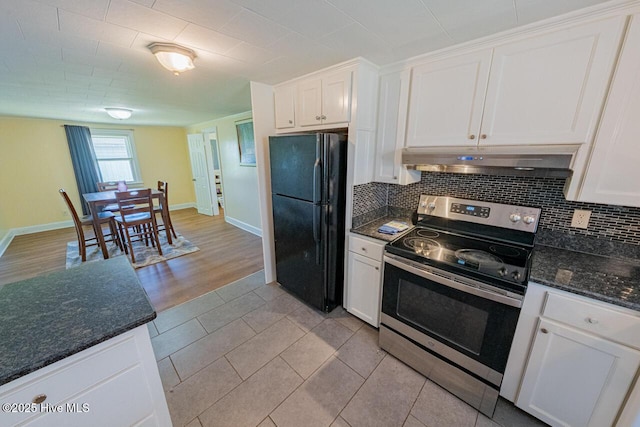 465 Meadstown Rd, Elizabeth City, NC 27909 - kitchen featuring tasteful backsplash, freestanding refrigerator, under cabinet range hood, and electric range
