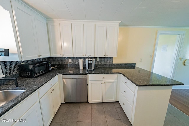 465 Meadstown Rd, Elizabeth City, NC 27909 - kitchen featuring black microwave, tile patterned flooring, stainless steel dishwasher, a peninsula, and white cabinetry