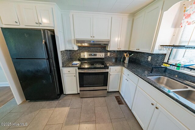 465 Meadstown Rd, Elizabeth City, NC 27909 - kitchen featuring electric stove, freestanding refrigerator, white cabinetry, decorative backsplash, and under cabinet range hood