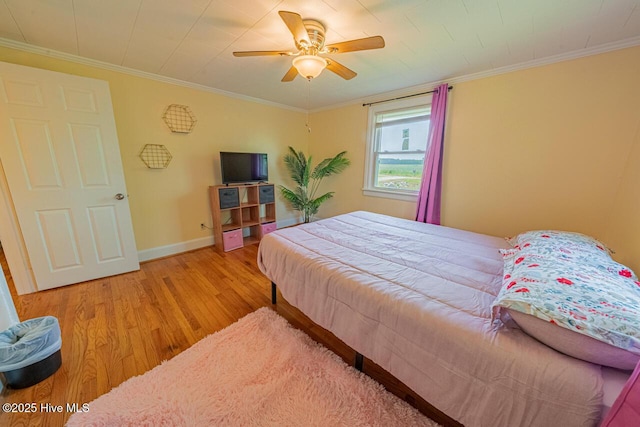 465 Meadstown Rd, Elizabeth City, NC 27909 - bedroom featuring crown molding, a ceiling fan, baseboards, and light wood-style floors