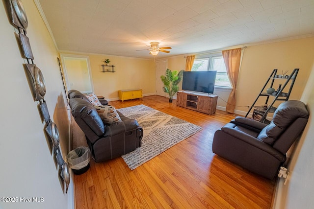 465 Meadstown Rd, Elizabeth City, NC 27909 - living room featuring crown molding, baseboards, a ceiling fan, and light wood-style flooring