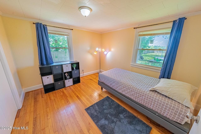 465 Meadstown Rd, Elizabeth City, NC 27909 - bedroom with crown molding, baseboards, and wood finished floors