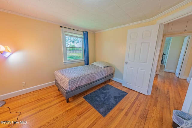 465 Meadstown Rd, Elizabeth City, NC 27909 - bedroom featuring baseboards, ornamental molding, and light wood-style flooring