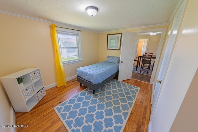 465 Meadstown Rd, Elizabeth City, NC 27909 - bedroom featuring crown molding, baseboards, and wood finished floors