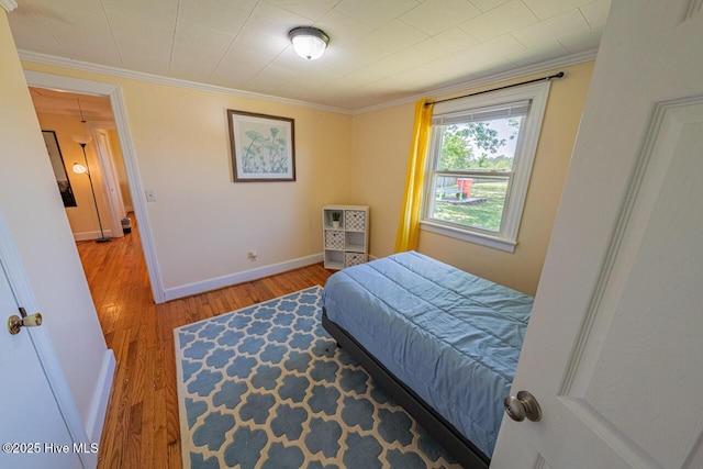 465 Meadstown Rd, Elizabeth City, NC 27909 - bedroom featuring baseboards, ornamental molding, and wood finished floors