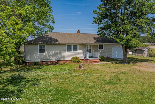 465 Meadstown Rd, Elizabeth City, NC 27909 - ranch-style house featuring a garage, a front yard, roof with shingles, a chimney, and a storage unit