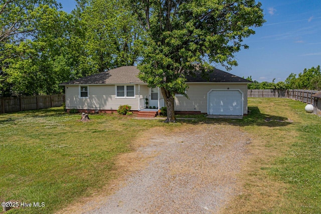 465 Meadstown Rd, Elizabeth City, NC 27909 - ranch-style house with a front yard, a fenced backyard, a shingled roof, an attached garage, and driveway