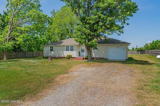 465 Meadstown Rd, Elizabeth City, NC 27909 - view of front of house with a garage, fence, driveway, and a front yard