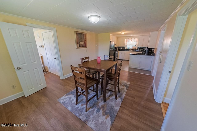 465 Meadstown Rd, Elizabeth City, NC 27909 - dining space with baseboards, ornamental molding, and dark wood finished floors