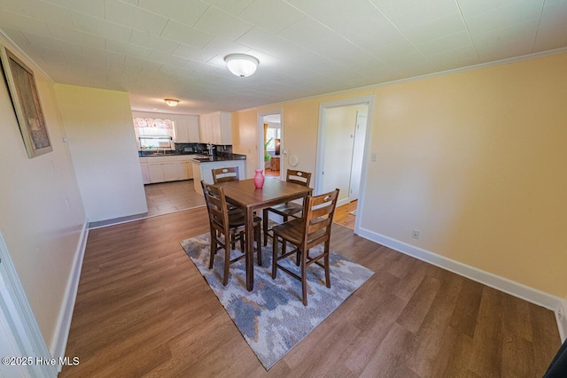 465 Meadstown Rd, Elizabeth City, NC 27909 - dining room with dark wood-style flooring, baseboards, and ornamental molding