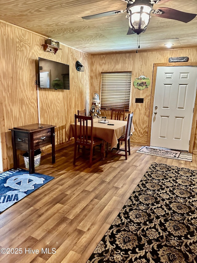 4998 Peacock Rd, Whiteville, NC 28472 - dining room with ceiling fan, wooden walls, light wood-style flooring, and wood ceiling