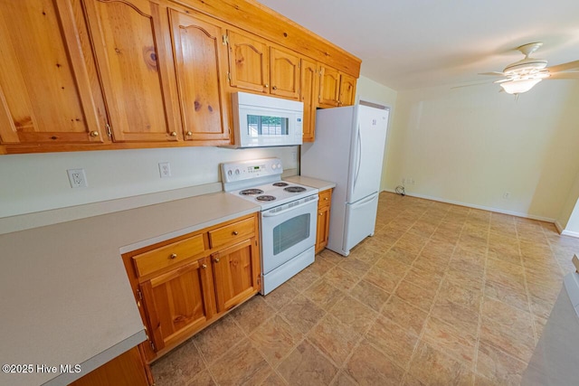 146 Ranch Dr, Elizabeth City, NC 27909 - kitchen with brown cabinets, white appliances, light countertops, a ceiling fan, and light floors