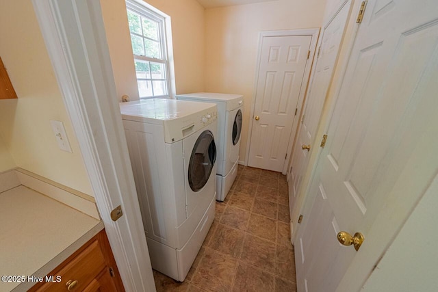 146 Ranch Dr, Elizabeth City, NC 27909 - washroom with cabinet space, washing machine and dryer, and light tile patterned floors