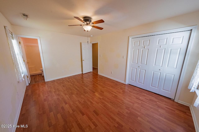 146 Ranch Dr, Elizabeth City, NC 27909 - unfurnished bedroom with ceiling fan, visible vents, wood finished floors, baseboards, and a closet