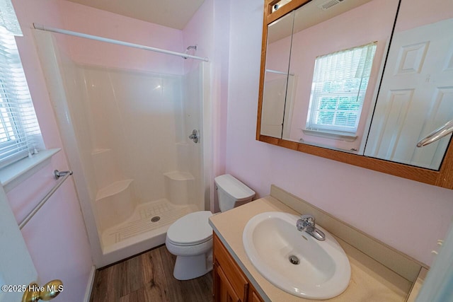 146 Ranch Dr, Elizabeth City, NC 27909 - bathroom with vanity, a shower stall, toilet, and wood finished floors