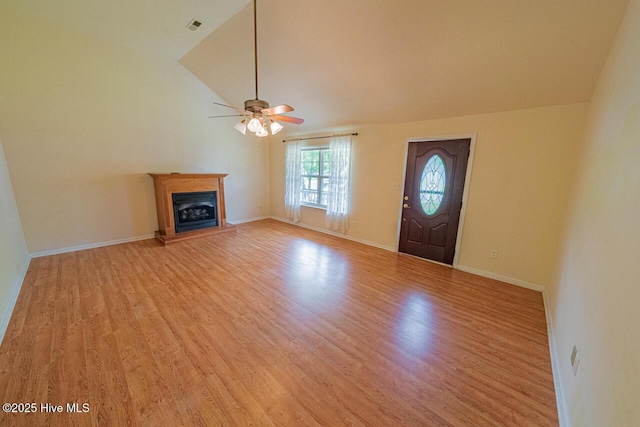 146 Ranch Dr, Elizabeth City, NC 27909 - entrance foyer featuring a ceiling fan, visible vents, a fireplace with raised hearth, lofted ceiling, and light wood-style floors