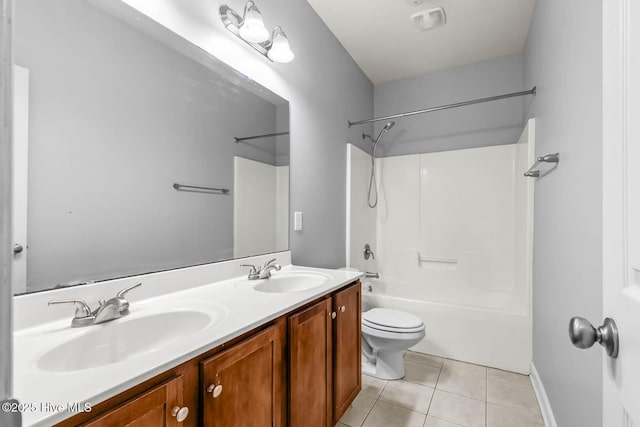 bathroom with tile patterned flooring, a sink, washtub / shower combination, and toilet