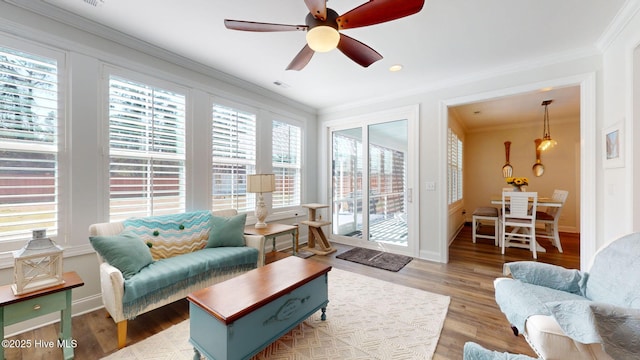 105 Camden Trl, Hampstead, NC 28443 - living room with ornamental molding, wood finished floors, ceiling fan, and baseboards