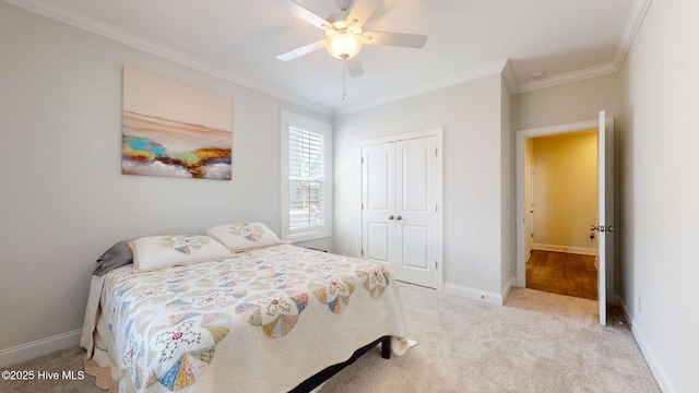 105 Camden Trl, Hampstead, NC 28443 - bedroom with crown molding, a closet, light carpet, baseboards, and a ceiling fan